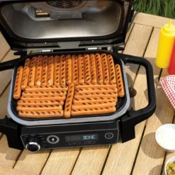 Ninja Woodfire Outdoor Grill & Smoker, 7-in-1 Master Grill, BBQ Smoker And Air Fryer With Woodfire Technology - OG701 -Garden & Outdoors GUEST d47d7071 140e 47b4 b31b 5a0e71053c12